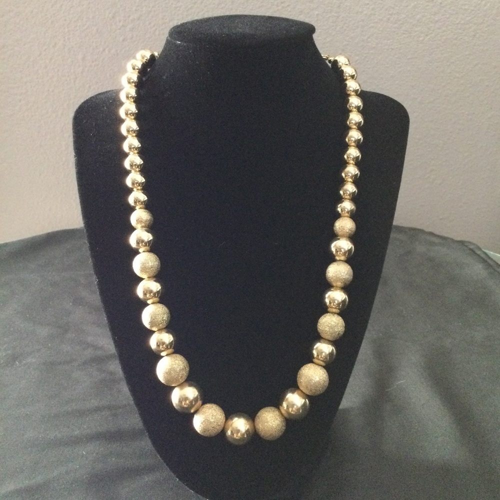 Understated simple gold beaded necklace-costume jewelry